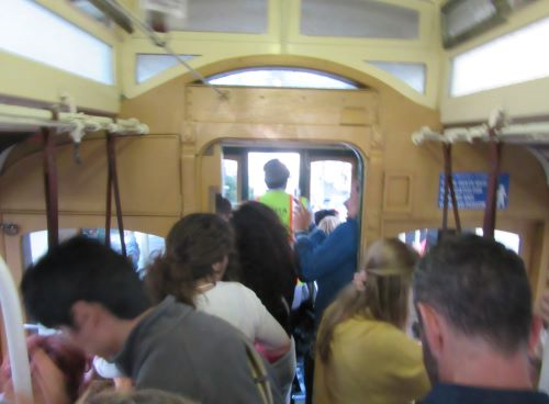 A teacher shares business English tips in  a San Francisco cable car - Business English book.